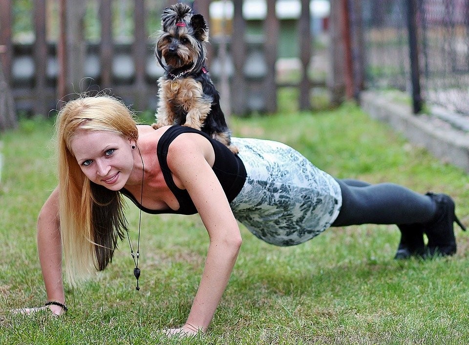 Woman Loading Up Using Her Dog