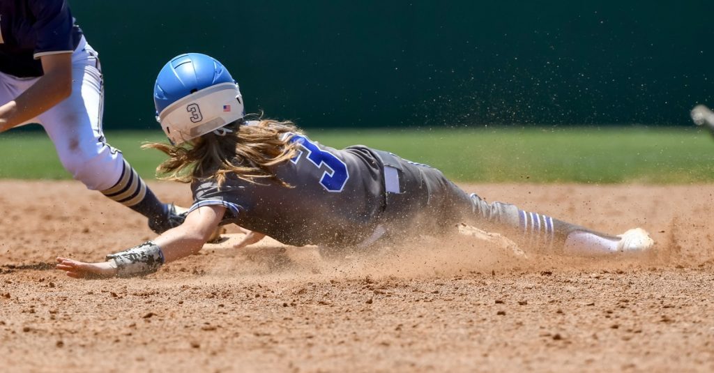 high school softball players in action