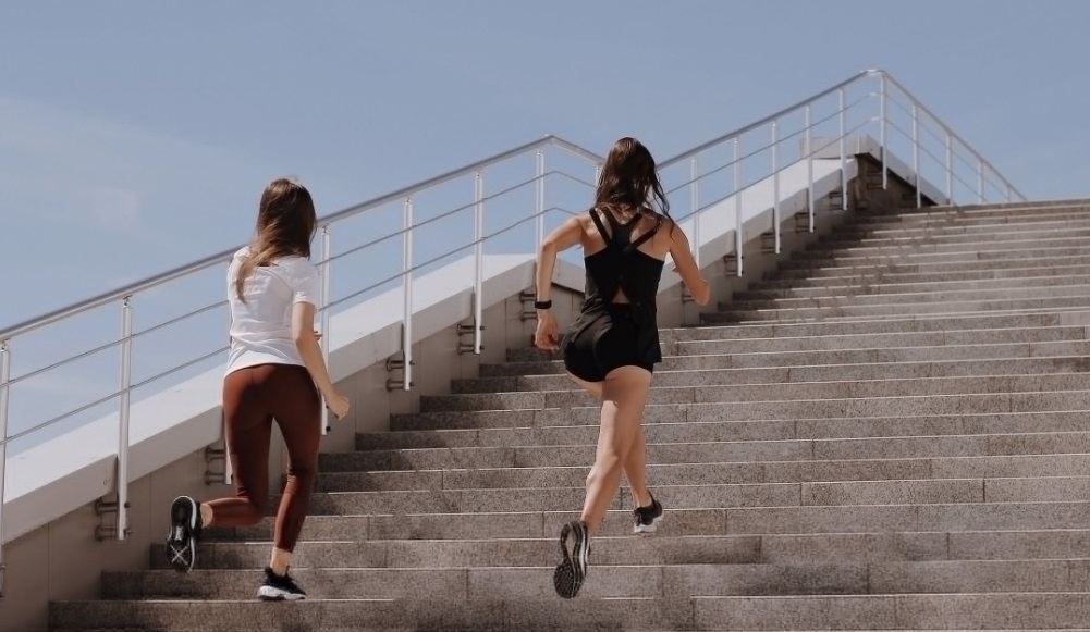 women running upstairs